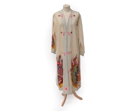 A Circa 1920's Indian/Nepalese Cream Wool Wedding Jacket, the back, cuffs and lower of jacket decorated with large crewelwork