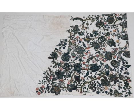 18th Century Wool Crewelwork Motifs, cut and stitched on to a later white linen cloth, decorative motifs include exotic birds