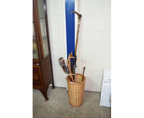 WICKER STICK STAND TOGETHER WITH CONTENTS INCLUDING VARIOUS WALKING STICKS, RIDING CROP AND SHOOTING STICK