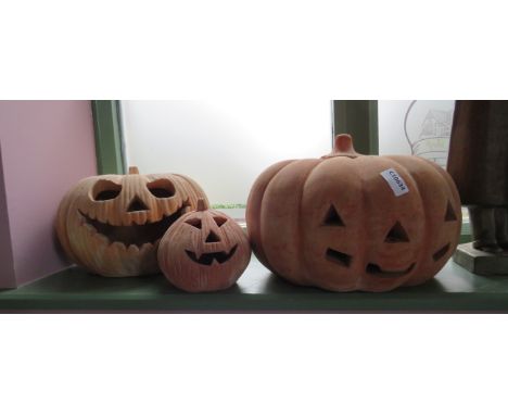 Three large ceramic pumpkins, the largest has a diameter of 13".