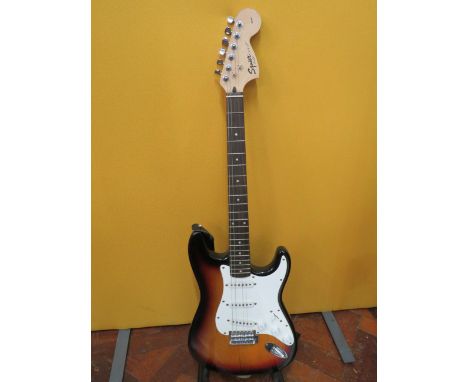 Squire Stratocaster in fair condition with light superficial wear. Neck/Headstock is straight in good order.  Two strings mis