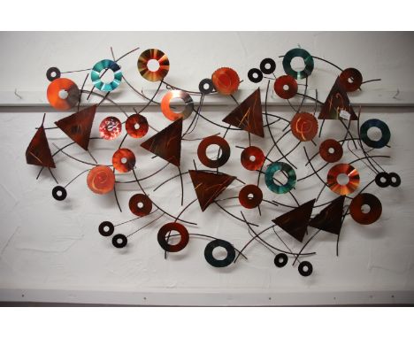 Abstract metal wall art which measures approx 48 x 30 inches. See photos. Postage is not available for this item . Courier or