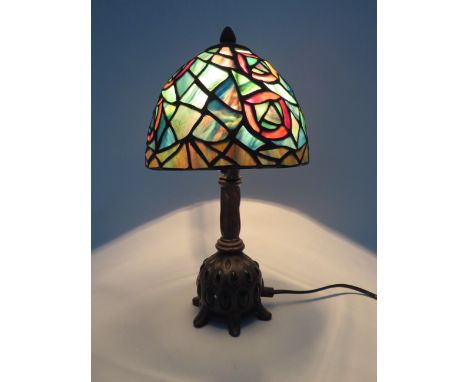 Vintage Tiffany style lamp with bronze effect metal stand set with green stones, 13" tall &amp; 7" shade diameter.