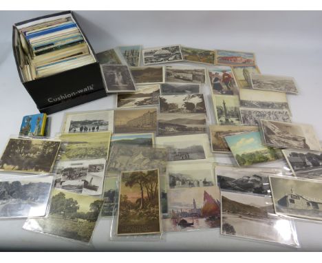 Shoe box of vintage postcards GB and America.