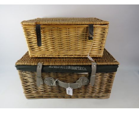 Two empty picnic / hamper baskets the largest measures 23" by 16" by 10.5".