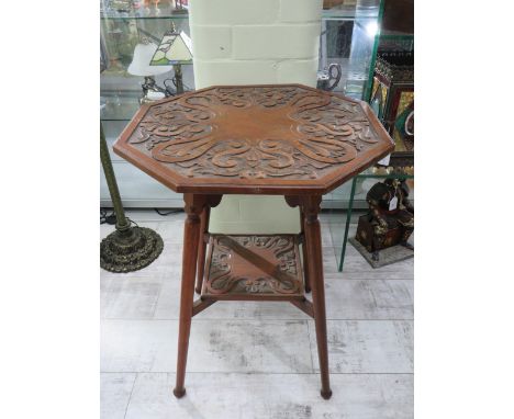 Lovely Arts &amp; Crafts style Octagonal Table with Carved Art Nouveau styling to top and shelf. In very good condition. H:28