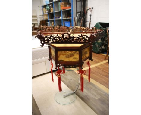 Oriental style hanging lantern with rural scenes to panel.  Some small decorative details missing.  H:18 x W:36 inches. Colle