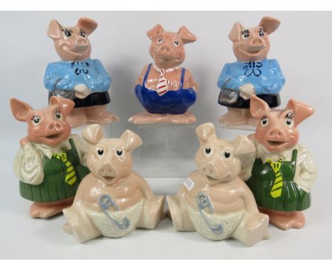 Seven Wade Natwest Pig money boxes all but one have stoppers.