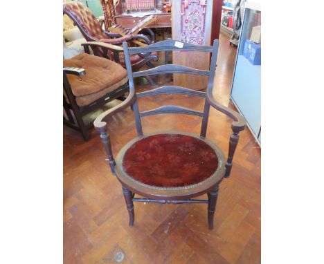 Interesting old Victorian chair with wide sweeping arms and ladder back. Seat height 14 inches. See photos