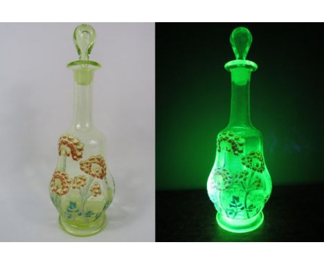 Victorian Uranium glass decanter with handpainted enamel flower decoration, 10.5" tall.