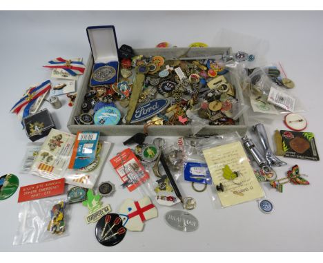 Large selection of vintage badges, tokens, coins and other collectable items.