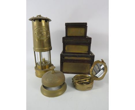 Mixed lot to include a Miner lamp, Brass bell, brass compass and trinket boxes all which fit inside the largest.