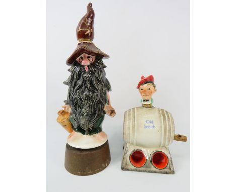 Vintage Goebel Hummel Scotch decanter and a Vintage Mountain Dew musical decanter, the tallest measures 13".