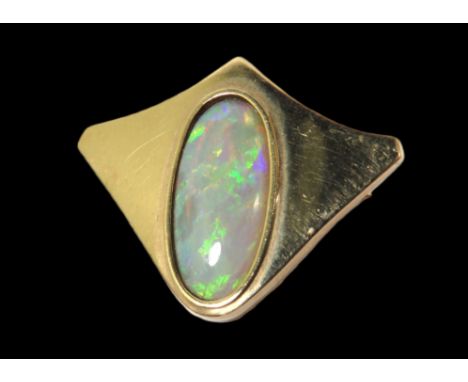 9ct Yellow Gold Brooch/ Pendant set with an Oval Opal which measures 19 x 9 mm. Hallmarked for London 1997. Makers initials G