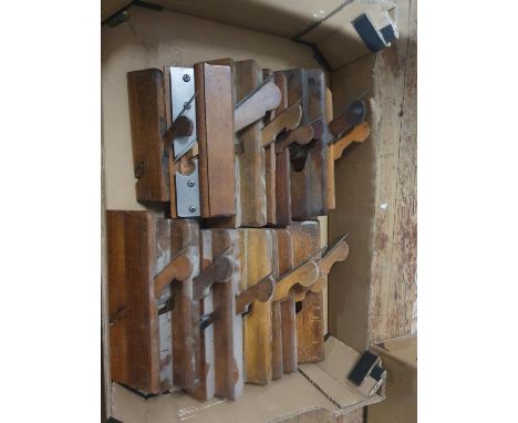 A box of assorted vintage moulding planes 