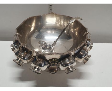 A good quality silver plated punch bowl with six goblets and ladle, does have dedication to side, shipping unavailable 