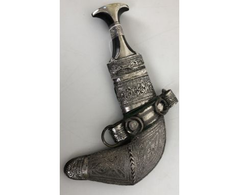 A Jambiya, in a silver coloured metal mounted scabbard, and a kukri, in a leather scabbard (2) 