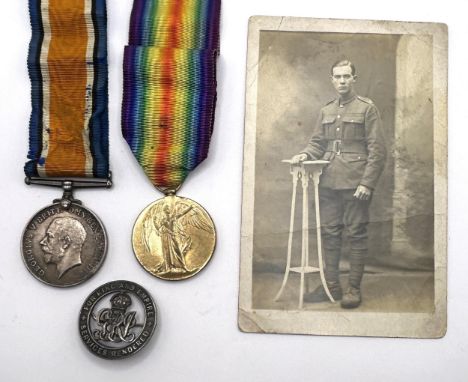 A British War Medal and Victory Medal pair, awarded to 41440 Pte T Gardner Manch R, with a silver wound badge, a few postcard