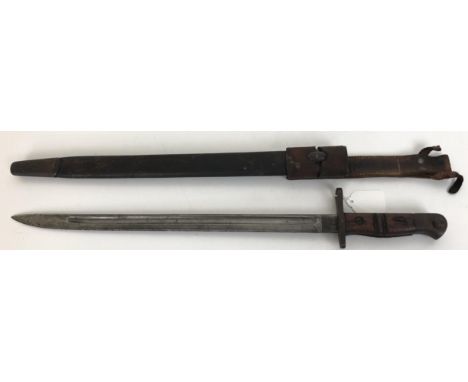 A Remington bayonet, numbered 1913 5 16, in a scabbard with a hangar 