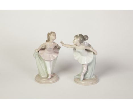 PAIR OF NAO, SPANISH PORCELAIN FIGURES OF YOUNG BALLERINAS, modelled standing in stylized poses, 7" (17.8cm) high, printed ma