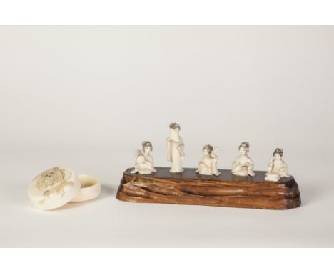 A SUITE OF FIVE SMALL EARLY 20TH CENTURY JAPANESE CARVED IVORY FIGURES OF GEISHAS seated playing instrument and one standing 