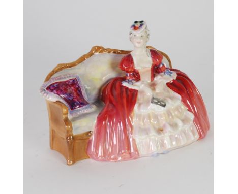 ROYAL DOULTON 'BELLE OF THE BALL' CHINA FIGURE HN 1997 modelled as a lady seated on a sofa, 6" (15.2cm) high, 8 3/4" (22.3cm)