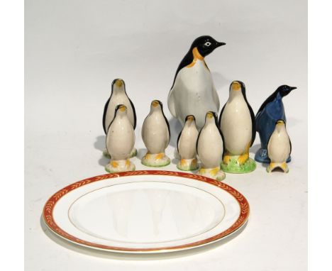 NINE POTTERY MODELS OF PENGUINS, including two Poole example, 8 3/4" (22.3cm) high and smaller, TOGETHER WITH A BOXED WEDGWOO