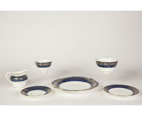 COALPORT FOR HARRODS 27 PIECE CHINA PART TEA SERVICE, now suitable for 7 persons, with mottled blue and gilt borders, compris
