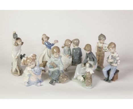 NINE NAO, SPANISH PORCELAIN FIGURES OF CHILDREN, including two modelled with rabbits, three modelled with dogs and a boy and 