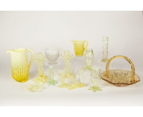 ELEVEN VARIOUS PIECES OF VASELINE GLASS INCLUDING JUGS, A HANDLED SHALLOW BOWL, TREE TRUNK FORM SPECIMEN VASES ETC (11)