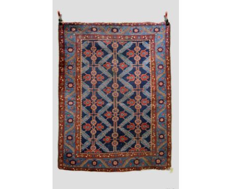 Two north west Persian rugs, Hamadan area, the first with all over design on an indigo field, 5ft. 10in. x 4ft. 5in., 1.78m. 