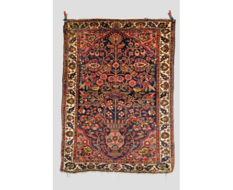 Two Bakhtiari rugs, Chahar Mahal Valley, south west Persia, about 1930s, the first 6ft. 7in. x 4ft. 9in. 2.01m. x 1.45m. Slig