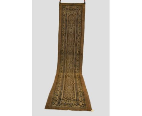 Sarab runner, north west Persia, early 20th century, 16ft. x 3ft. 5in. 4.88m. x 1.04m. Overall wear; patch right side border 