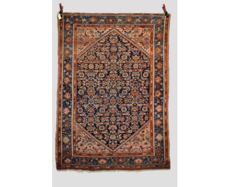 Two Hamadan rugs, north west Persia, mid-20th century, the first 7ft. x 4ft. 10in. 2.13m. x 1.47m. The second 6ft. 5in. x 4ft