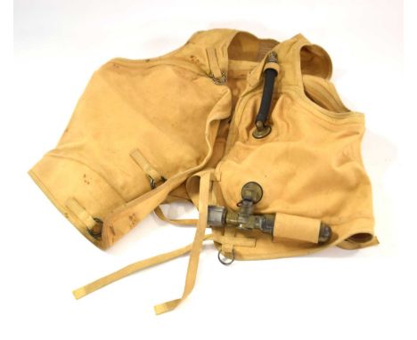 A Second World War Third Reich Luftwaffe SWP734 model Schwimmweste, 1940 dated complete with C02 cannister and air blow tube,