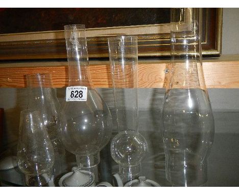 A quantity of old oil lamp chimneys,.