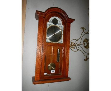 A modern wall clock. COLLECT ONLY.