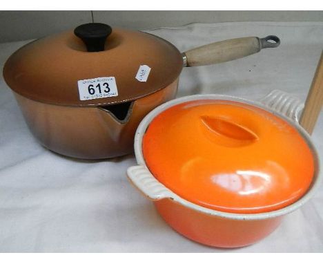 A  Le Creuset cast iron pan and a ceramic casserole dish. 