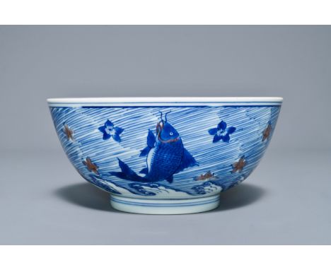 Full title: A rare Chinese blue and underglaze red bowl with carps and marine animals, Xuande mark, Kangxi------- Description