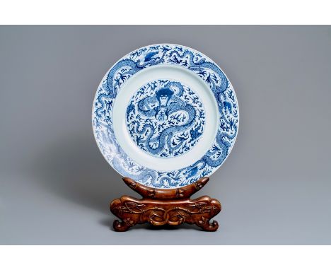 Full title: A massive Chinese blue and white 'dragon' dish, Kangxi------- Description: Dia.: 56 cmÊ Please note that the carv
