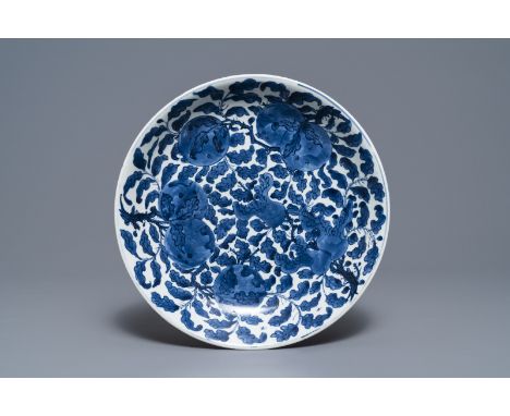 Full title: A Chinese blue and white charger with sanduo fruits among foliage, Kangxi------- Description: Dia.: 34,5 cm