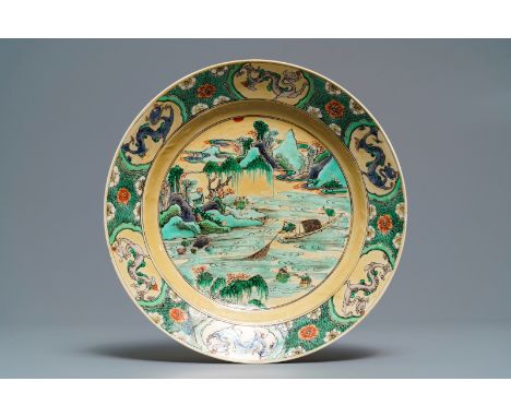Full title: A Chinese famille verte cafŽ-au-lait ground plate with fishermen, Kangxi------- Description: Dia.: 26,5 cm