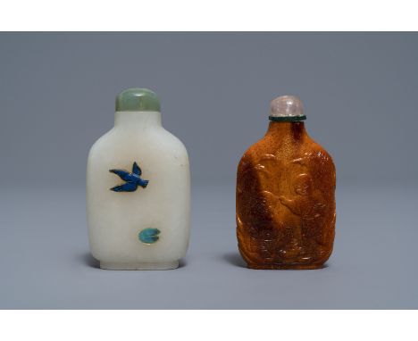 Full title: Two Chinese hardstone-embellished white jade and carved amber snuff bottles,18/19th C.------- Description: H.: 7,