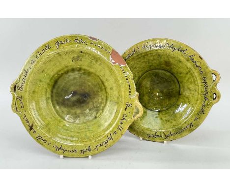 NEAR PAIR OF EWENNY POTTERY FRUIT-DISHES in light mottled green glaze, border with sgraffito inscription 'Tri pheth a geiff d