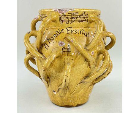 EWENNY POTTERY VASE BY HORACE ELLIOTT with multiple loop handles in yellow glaze overall, amusingly inscribed in sgraffito 'A