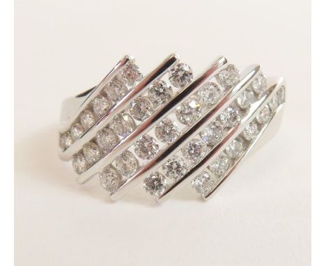 An 18ct white gold diamond set dress ring, the five diagonal rows of round brilliant cut stones each set with seven diamonds,