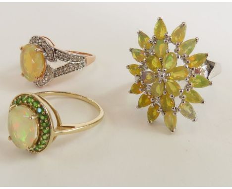 A 9ct gold Ethiopian opal and chrome diopside ring, finger size P 1/2, 2.59g gross; a 9ct rose gold opal and white stone ring