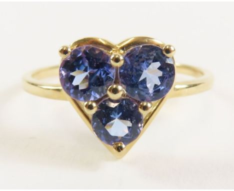 A 9ct gold three stone tanzanite dress ring, the three oval stones set within a heart shaped mount, finger size R 1/2, 2.27g 