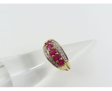 A 9ct gold ruby and diamond dress ring, the five graduated rubies with a row of small diamonds to either side, finger size O 