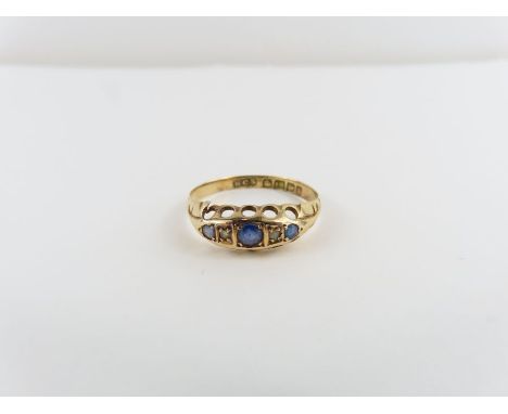 An 18ct gold sapphire and diamond ring, finger size N, 1.4 g gross